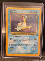 Front of 1999 Pokémon Lapras holographic card in sleeve