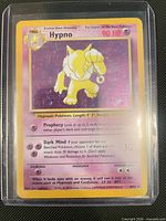 Front of Hypno holographic card in sleeve showing set details