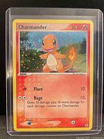Front view of Charmander holographic card in toploader
