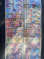 All 22 sleeved cards laid out in three columns