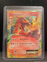 Front view of 2016 Charizard EX full art holo card in top-loader