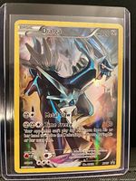 Front view of sleeved Dialga XY17 full-art holo card in toploader
