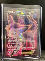 Front of Espeon EX full art holo card inside toploader