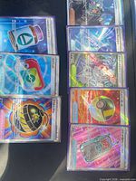 All seven sleeved cards laid out