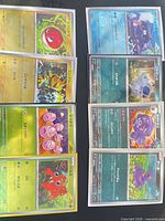 Eight Japanese Poké Ball foil cards in two columns of four