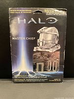Front of package showing Metal Earth Halo Master Chief Helmet kit