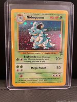 Front of sleeved Nidoqueen holographic card