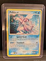 Front of Palkia card in toploader