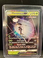 Front view of Pheromosa-GX card inside top loader