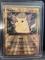 Front of Pikachu gold foil promotional card in plastic sleeve