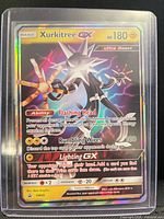 Front of Xurkitree GX SM68 rainbow holo card in sleeve
