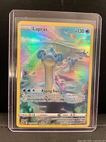 Front of Lapras holographic full art card inside toploader