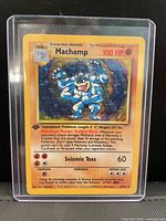 Front of Machamp holographic card in toploader