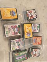 Stacks of Pokémon TCG Live promo code cards in resealable bags