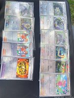 All sleeved Pokémon cards laid out in two columns