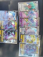 Two columns of 10 sleeved Pokémon V promo cards laid out
