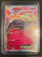 Front of Xerneas EX 97/146 card in top loader showing Pikachu 25th stamp and holofoil artwork