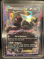 Front of Umbreon EX card showing holographic full-art design