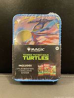 Front view of sealed Magic: The Gathering Teenage Mutant Ninja Turtles collector tin