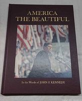 Front cover showing title, color photo of JFK