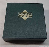 Closed dark green Upper Deck binder top view