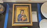 Front view of framed mosaic icon