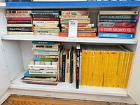 Two shelves showing magazines and books