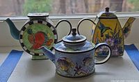 Three cloisonné teapots front view
