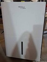 Front view of white SoleusAir dehumidifier with water-level window