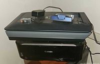 HP ScanJet G4050 scanner stacked on Canon MG5320 printer