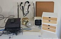 Group view of clocks, storage cubes, speakers, tote, map and cork board