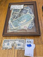 Framed painting with faux bill and lot tag visible