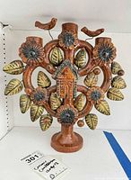 Front view of ceramic Tree of Life candelabra showing overall design