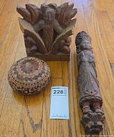 Overview of all three carvings with scale card