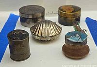 Five small boxes displayed front and back rows