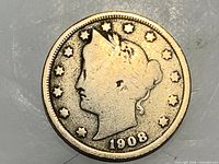 Obverse showing Liberty profile, stars, date 1908
