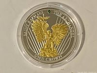 Obverse view of the 2015 One Crown two-tone angel round in capsule