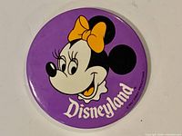 Front of purple Disneyland Minnie Mouse button