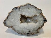 Front view showing polished face and druzy cavity