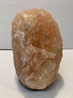 Front view of Himalayan salt lamp showing overall form and color