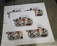 Five identical prints laid out showing full graphic and paper edges