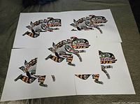 Five overlapping unsigned Sea Monster prints, full view