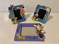 All three Disney resin photo frames grouped