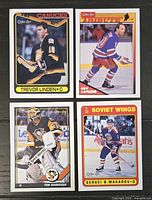 Front view of four O-Pee-Chee hockey cards laid out together