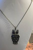 Owl pendant necklace on display bust