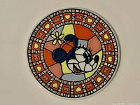 Front of coaster showing mosaic Minnie Mouse design