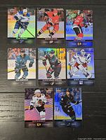 Eight Upper Deck holographic hockey cards arranged in three-row grid showing card fronts