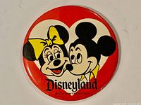Front view of round Mickey & Minnie Disneyland pinback button