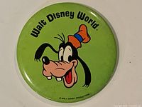 Front of green Goofy pinback button showing cartoon and Walt Disney World text