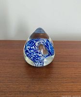 Front view of teardrop paperweight showing blue and white swirl